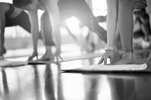 Group Young woman doing yoga and stretching exercises in the Studio. Group Young woman doing yoga and stretching exercises in the Studio.